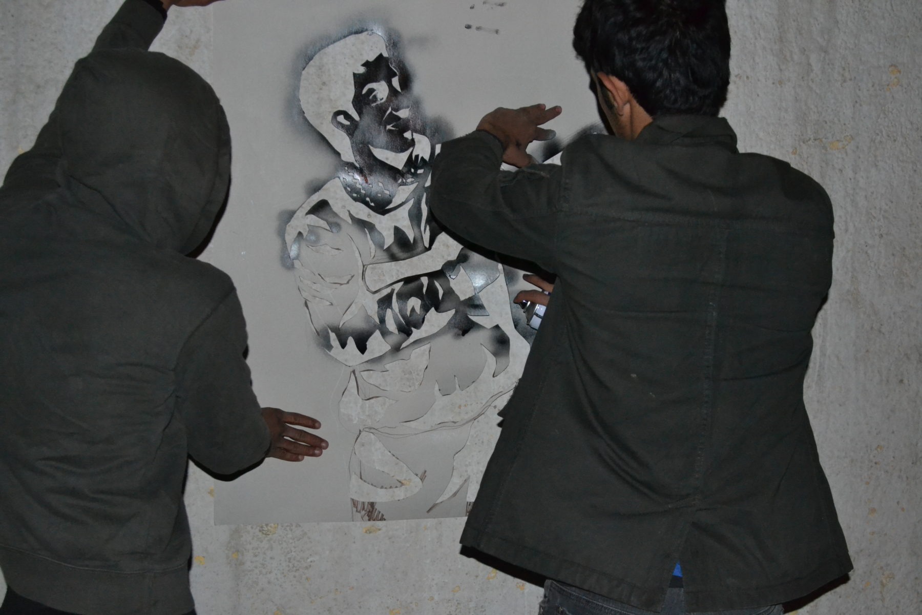 Sajjad Abbas doing graffiti in Baghdad, Iraq